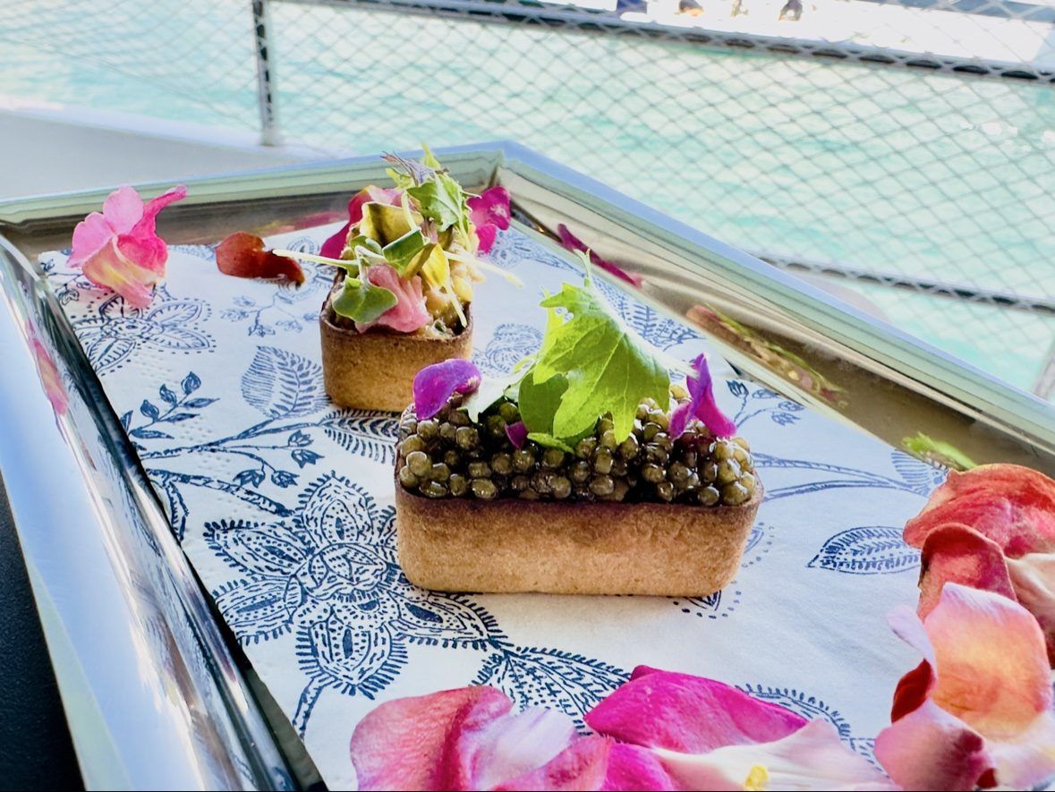 Caviar tartlets served on deck