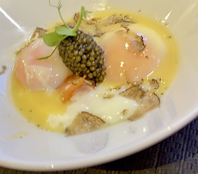 Poached eggs with caviar and shaved truffle