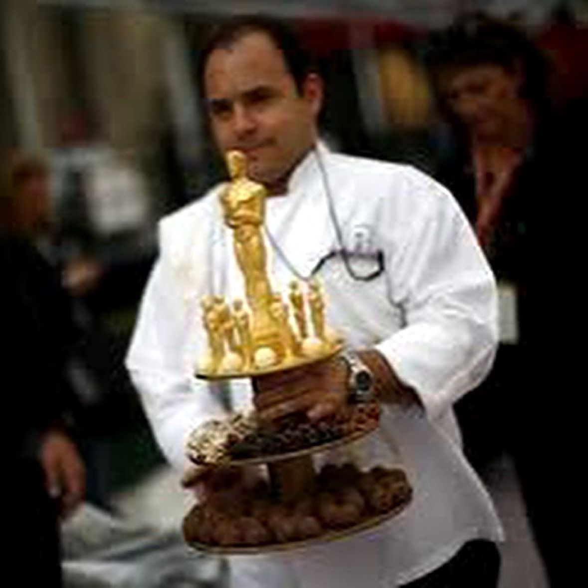 Chef carrying the chocolate Oscar dessert tower