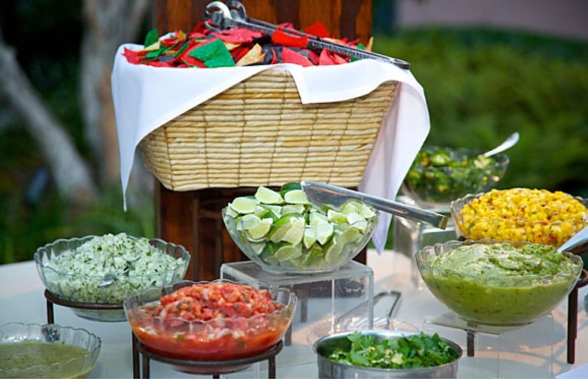 Salsa and guacamole station with fresh limes