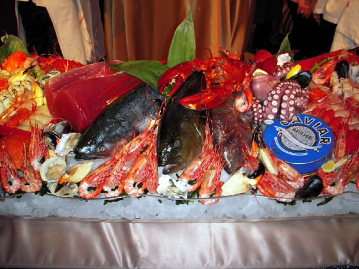 Seafood display on ice with lobster prawns and caviar