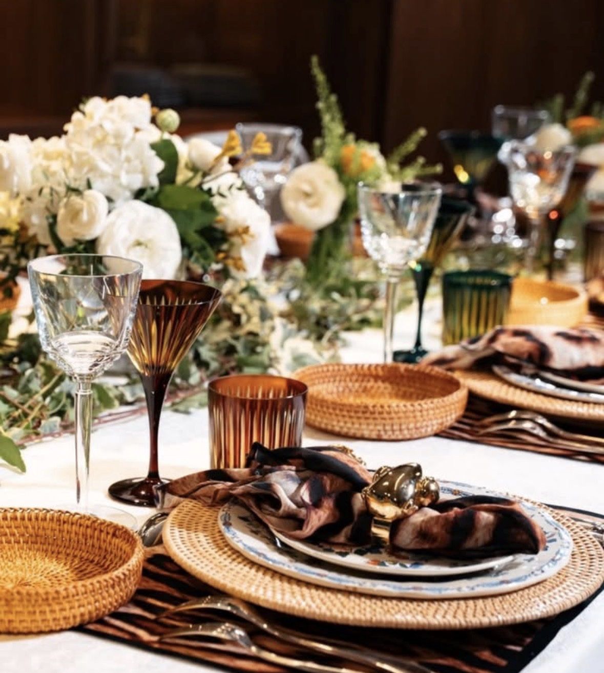 Autumn place setting with rattan chargers and amber glass
