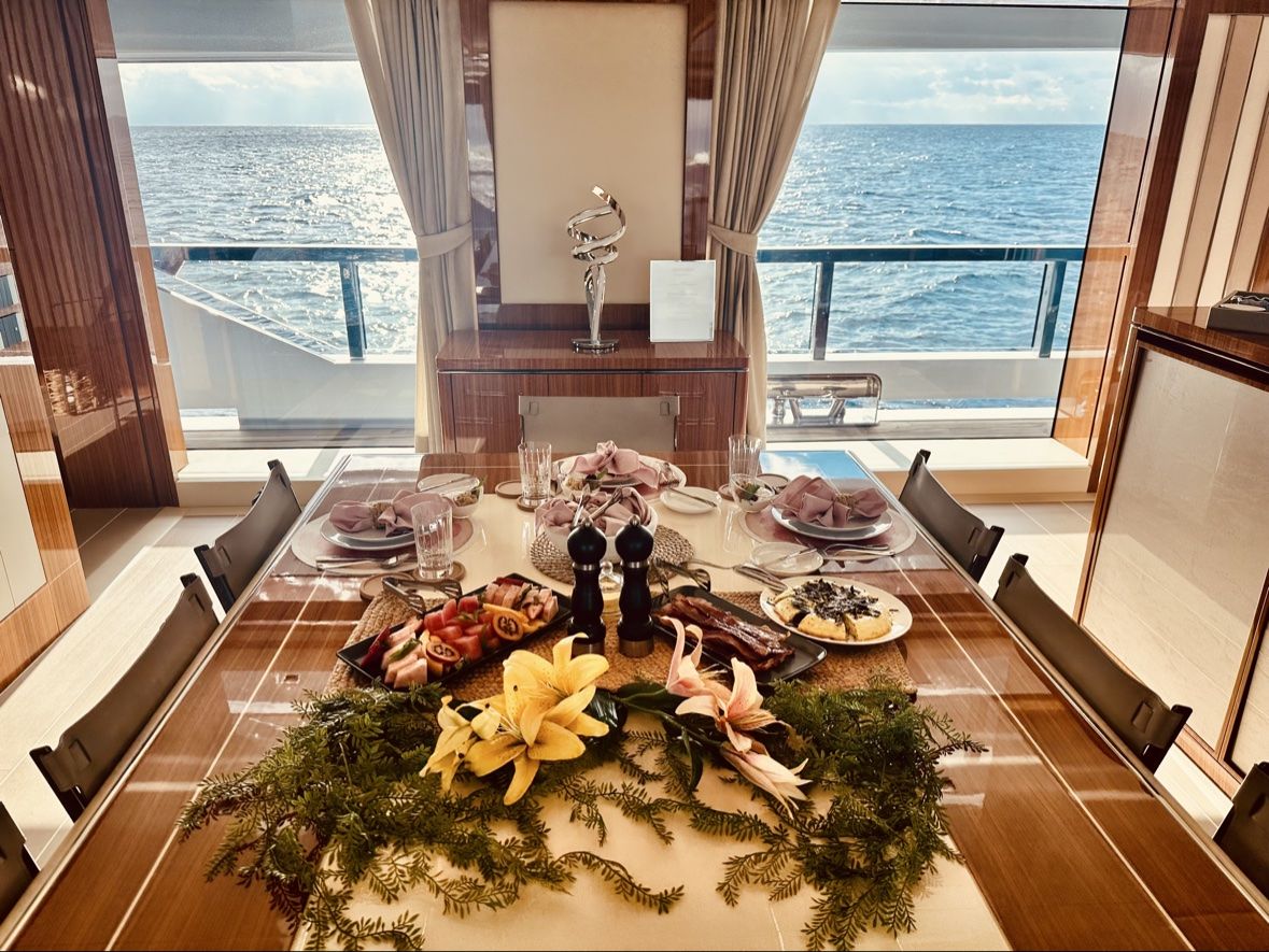 Breakfast spread laid along the table in morning light