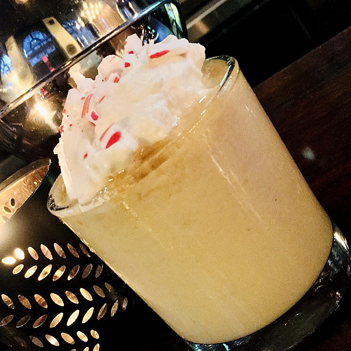 Peppermint cream cocktail with candy cane
