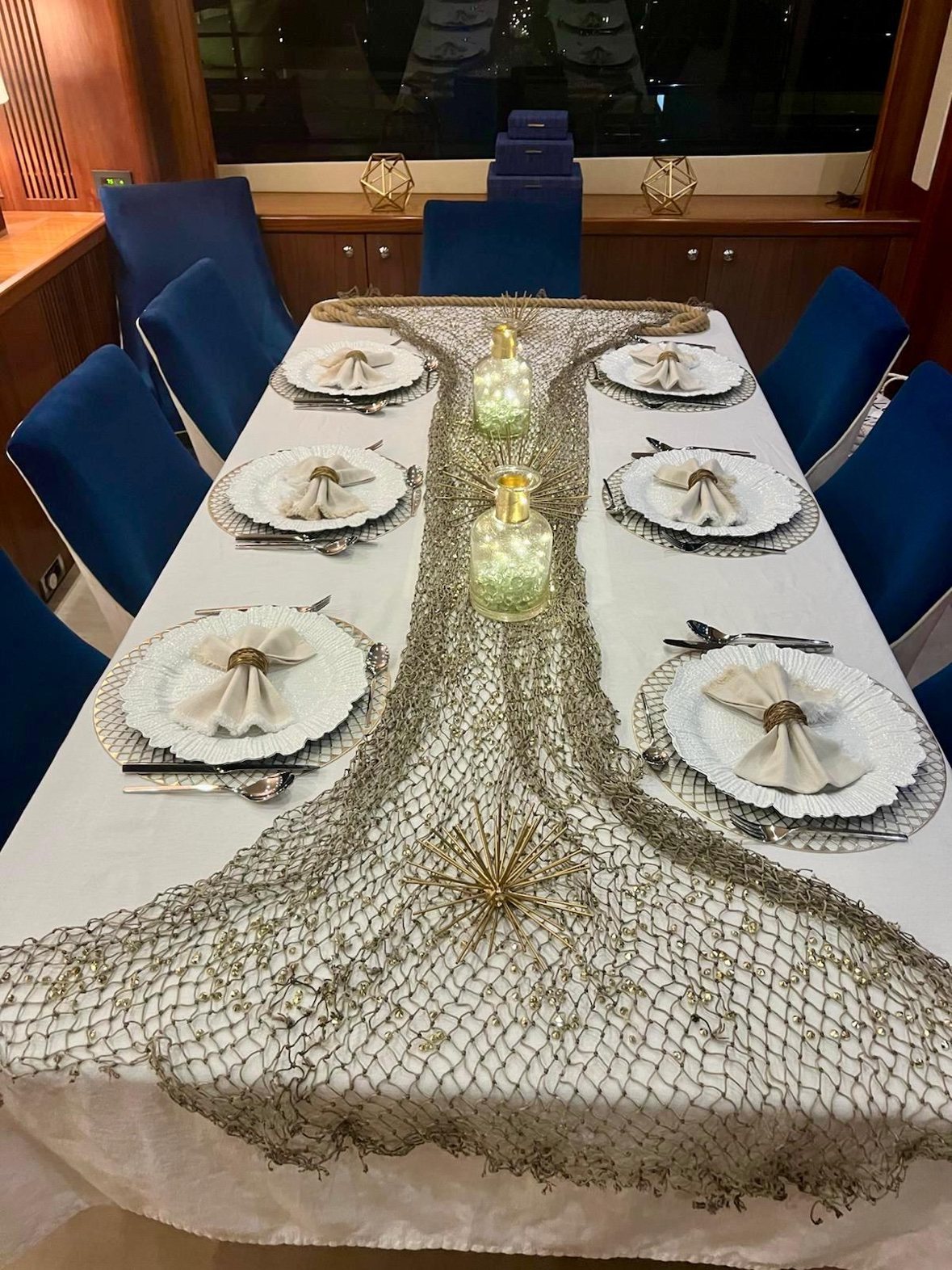 Nautical themed tablescape with gold decor